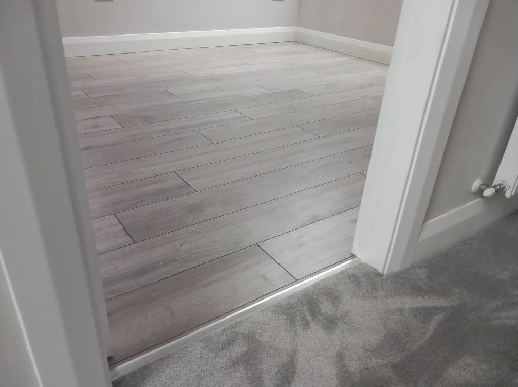 Carpet and wood flooring hallway
