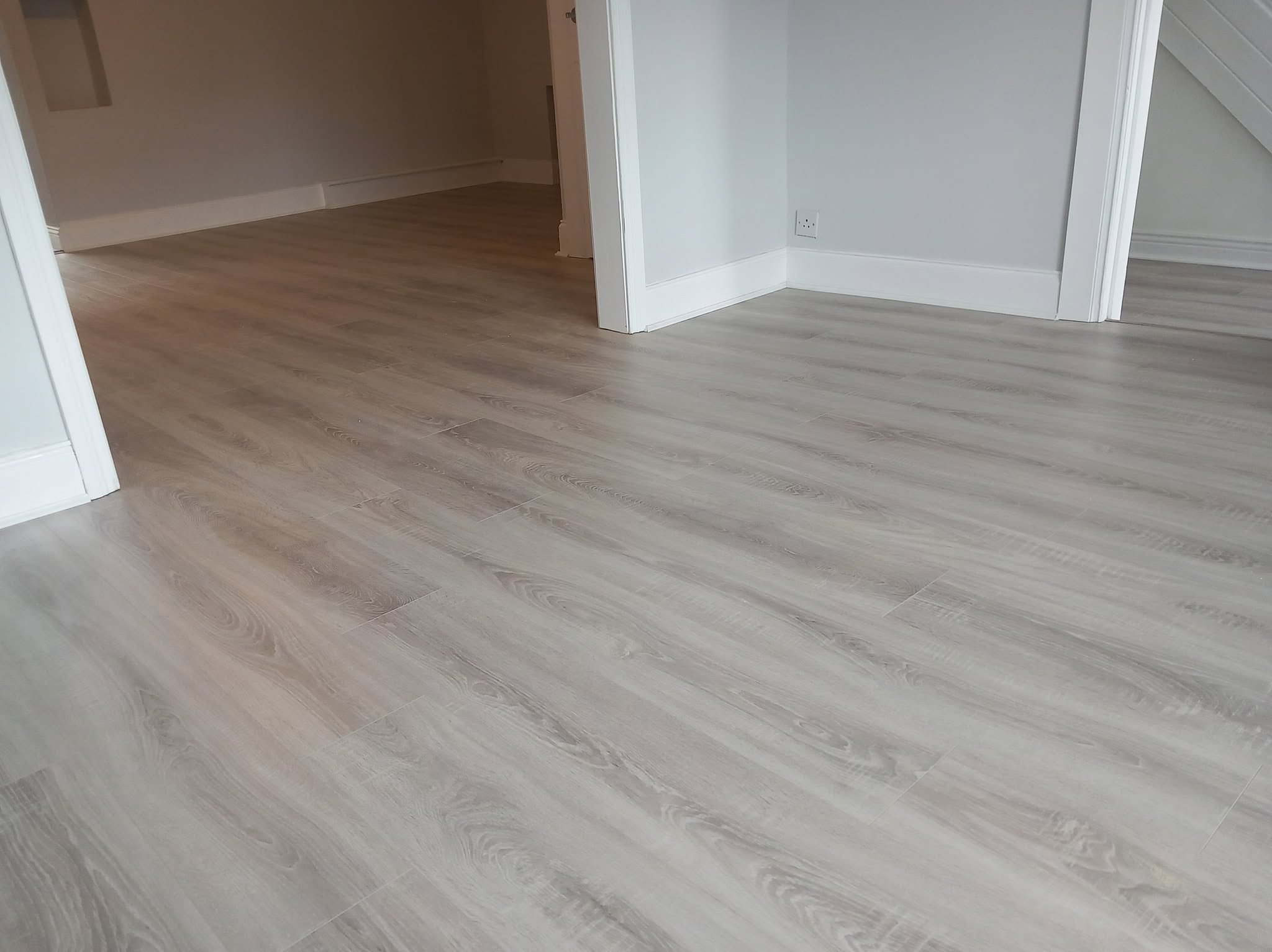 Grey wood flooring installation
